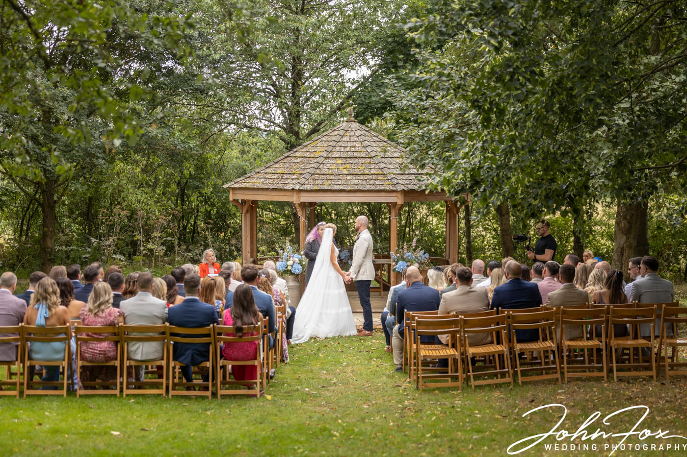 Outdoor ceremony in woodland at Crockwell Farm in Northamptonshire.