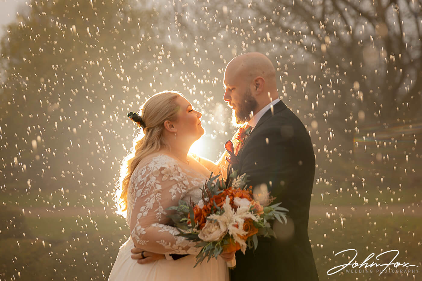 Bride and Groom rain shot at Crockwell Farm in Northamptonshire.