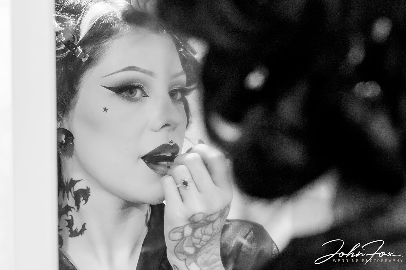 Gothic Wedding with a Stunning Bride in Black on Halloween - The bride adding her makeup.