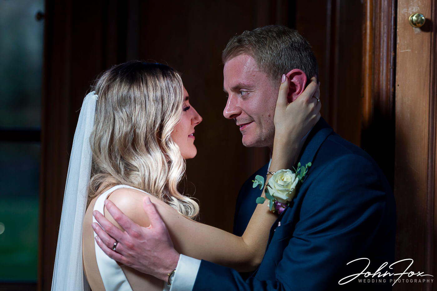 James and Lorna embracing each other in a quiet part of Chicheley Hall.