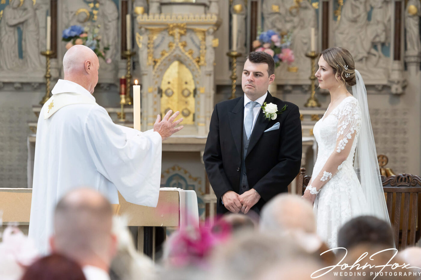 The bride and groom take their vows at St Mary's Church.