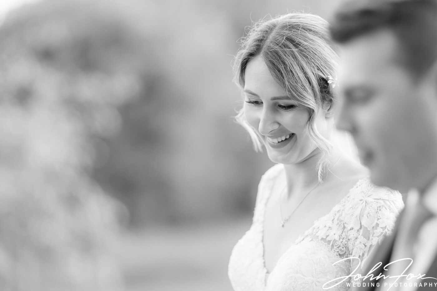 A smiling bride on her wedding day. Photo by John Fox Wedding Photography