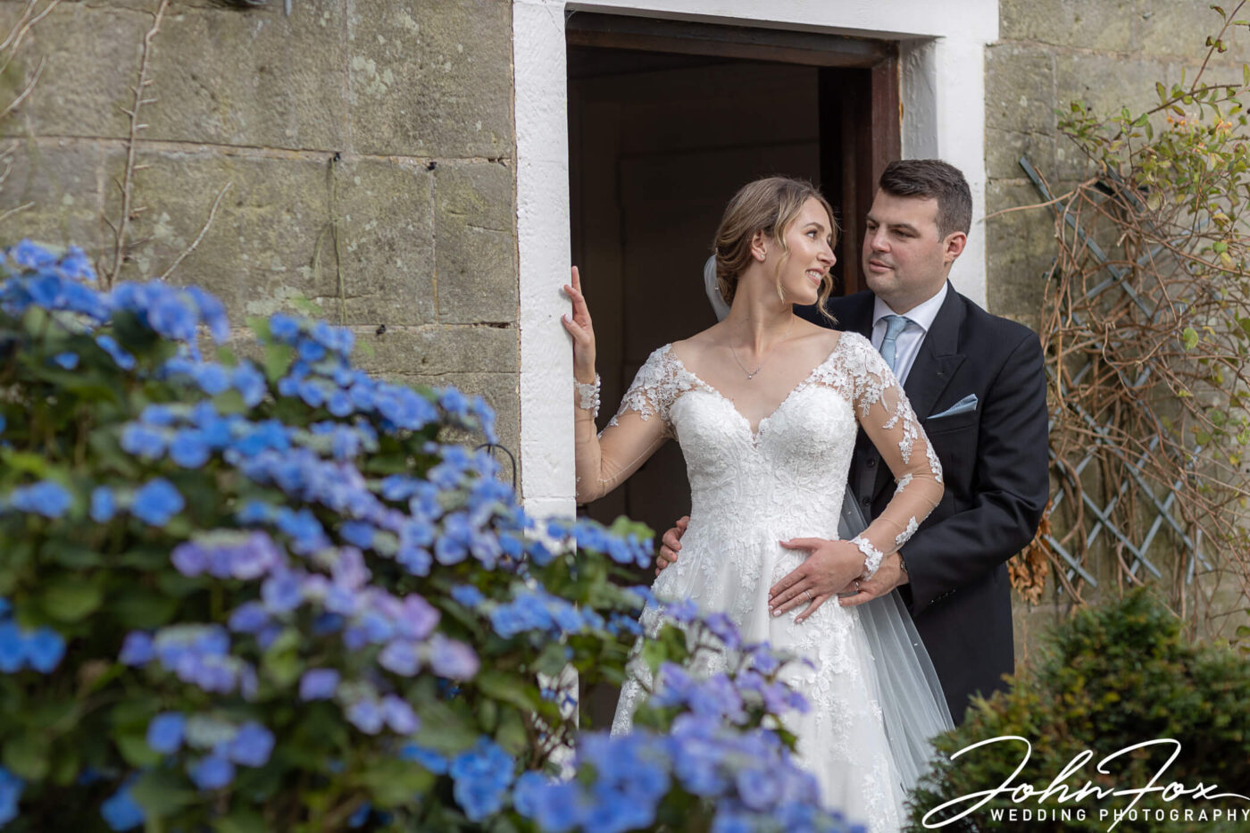 The happy couple in a doorway on the family farm in Derby.