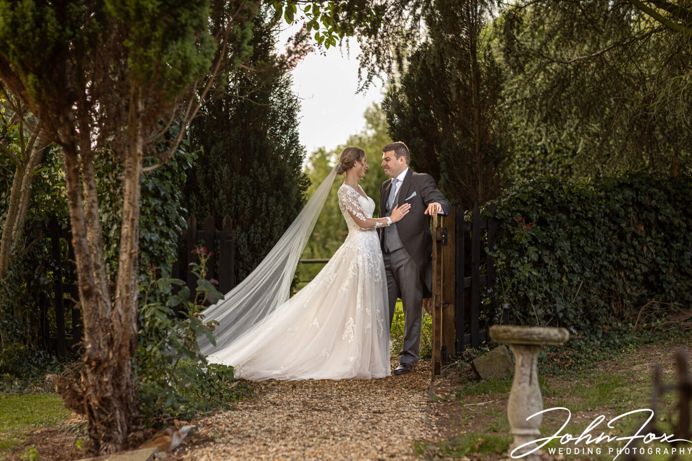 The newly weds outside the church in Derby. Photo by John Fox Wedding Photography.