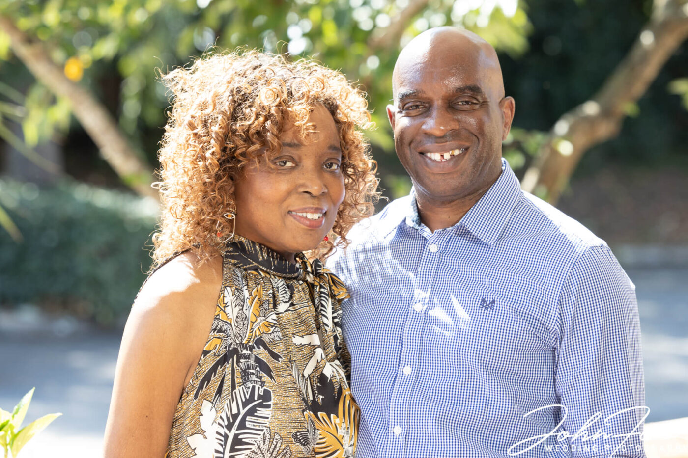 The happy couple in the beautiful grounds of a hotel in Bristol. Photo by John Fox Wedding Photography.