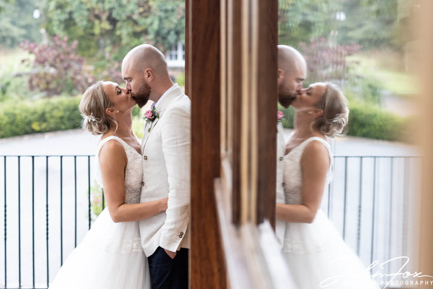 The newly weds kissing on their special day at Crockwell Farm.